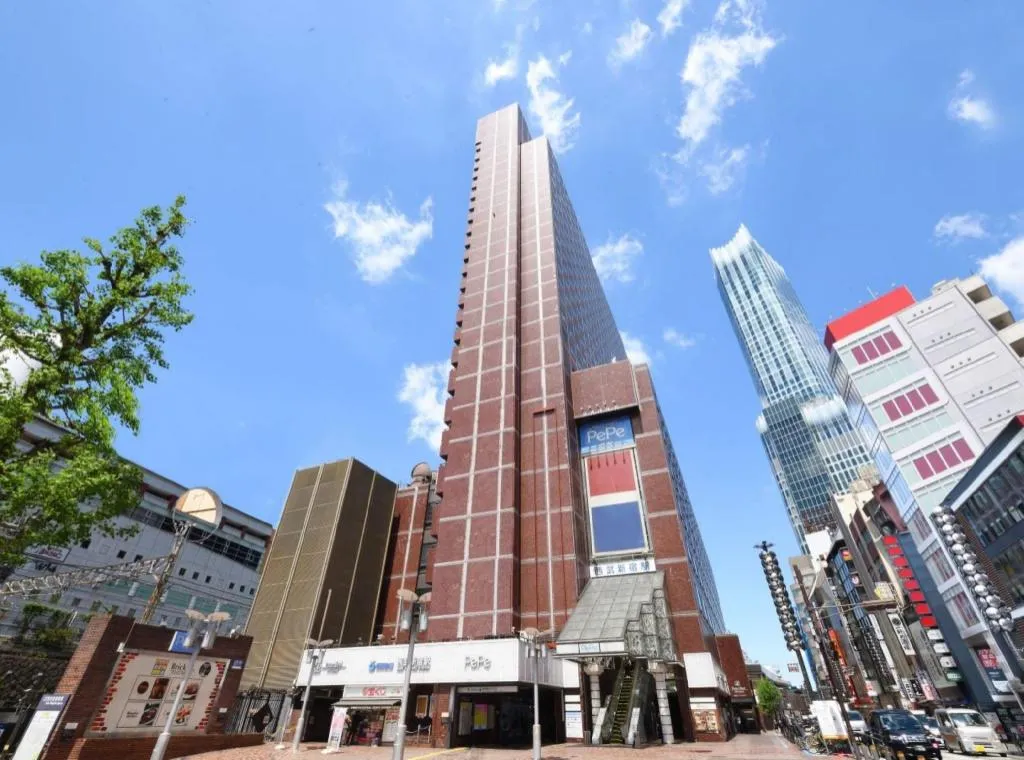 Red exterior wall of Shinjuku Prince Hotel, in the same building as Seibu-Shinjuku Station